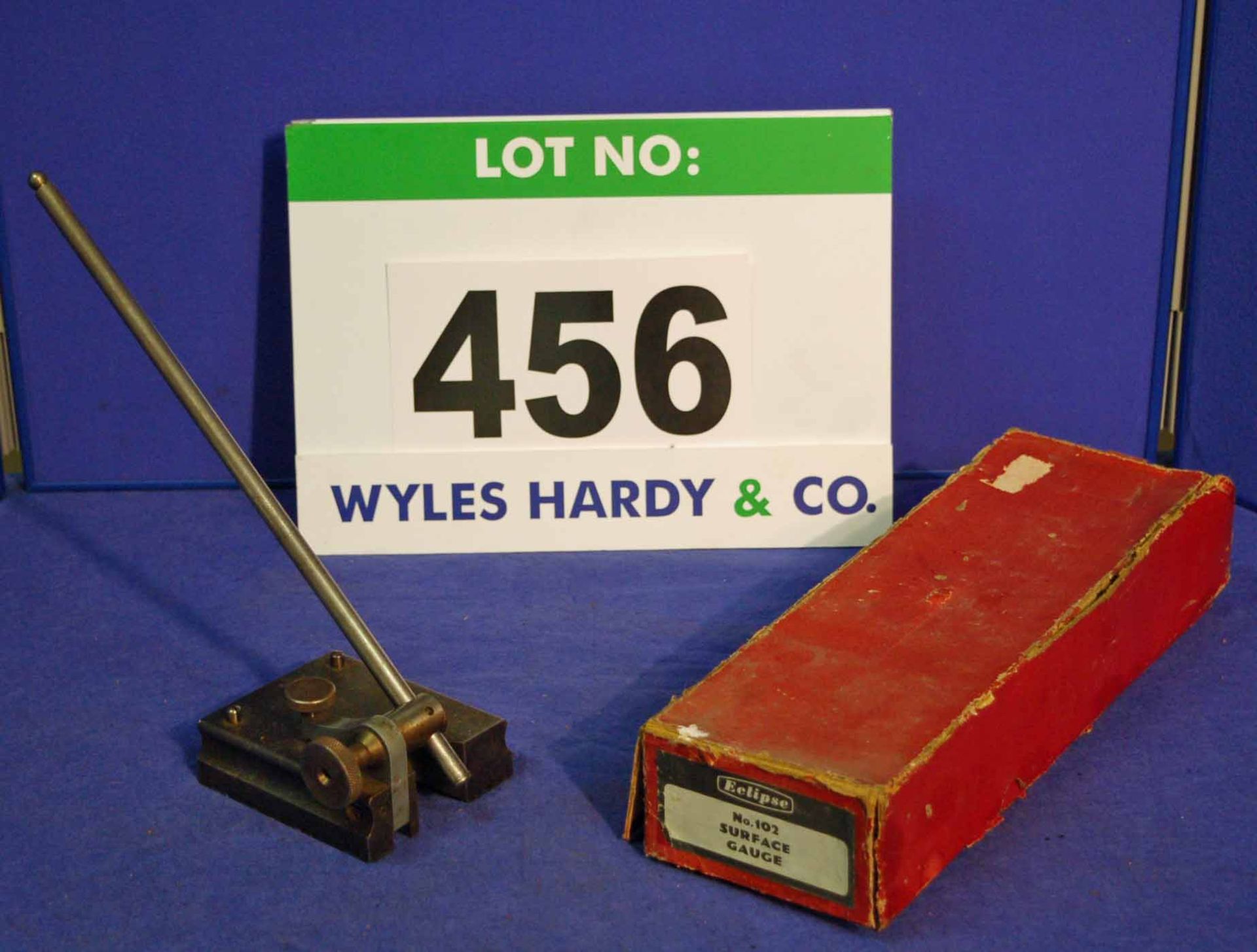 A 12 inch Gauge Stand in Red Cardboard Box