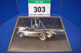 A Framed and Glazed Black and White Photograph showing 1955 Bristol 450 Race Car No. 33 at Le Mans