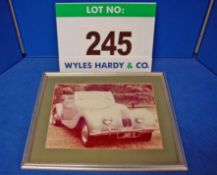 A Framed and Glazed Colour Photograph of A Bristol 400 Cabriolet (JMR 11) Given to the Company and