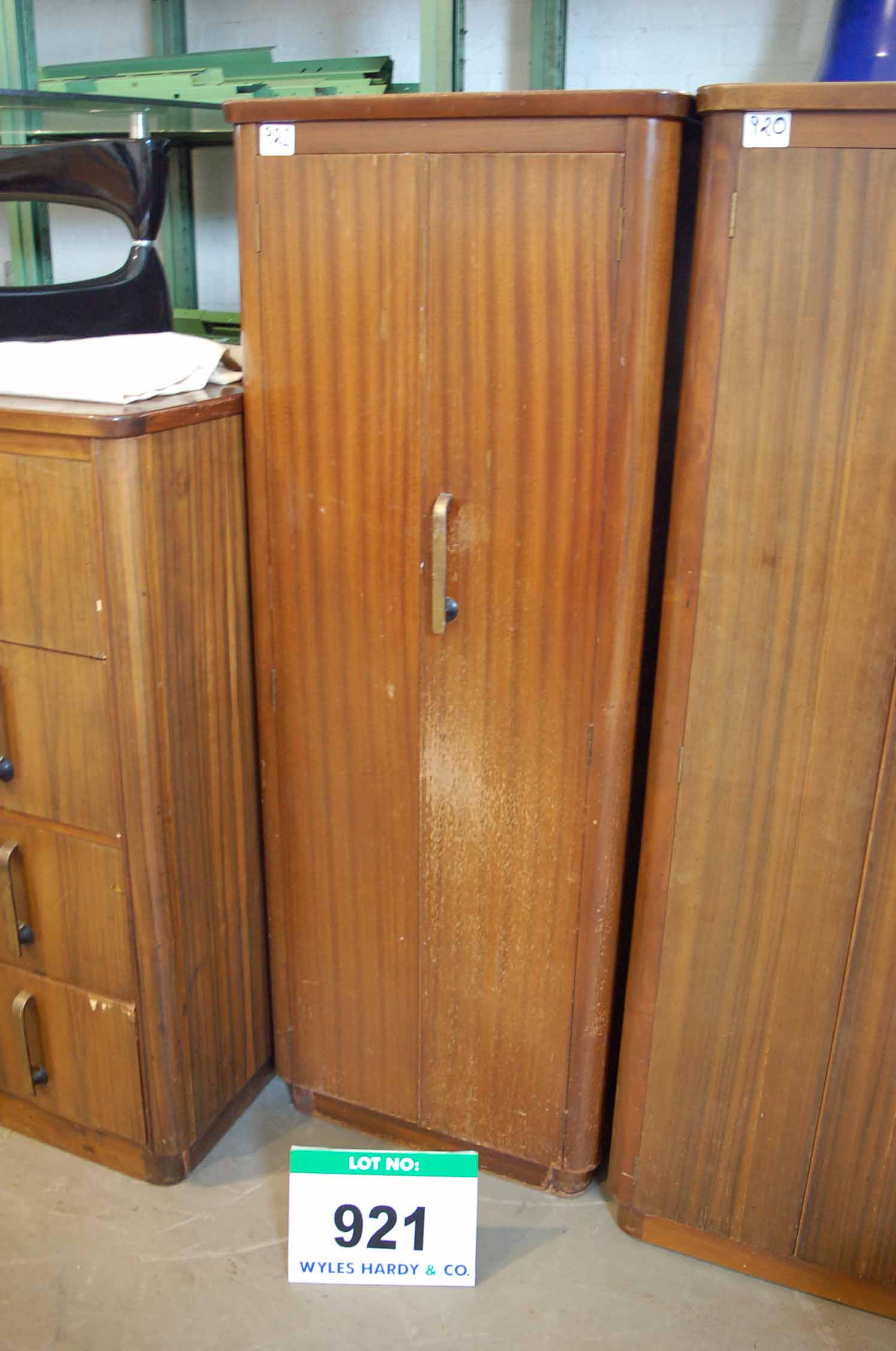 A Sapele Tall Double Door Wardrobe Storage Cupboard with Brass Art Deco Handles (Damage to Veneer)