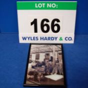 A Framed and Glazed Black and White Photograph showing Engineers at The Bristol Cars Ltd Factory