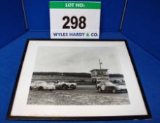 A Framed and Glazed Black and White Photograph showing 1953/4 Bristol 450 Race Car No. 21 Fighting