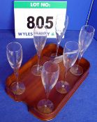 A Set of Six Champagne Flutes on A Bentwood Tray