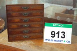 A Mahogany Veneer Desktop 6-Drawer Forms Storage Unit, for restoration (Note: One Handle Broken)