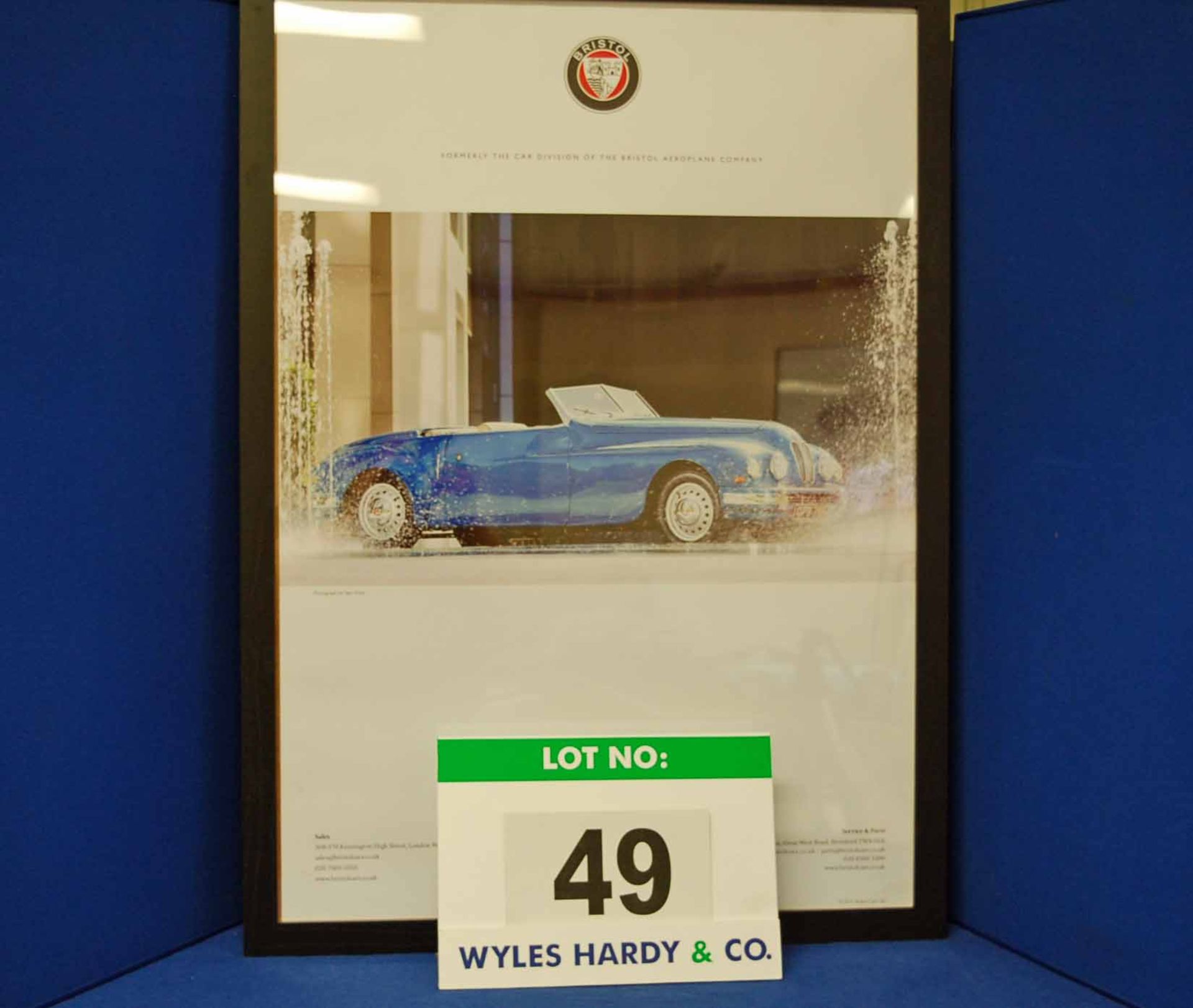 A Framed and Glazed Promotional Poster depicting OPB 706, A Blue Bristol 402 Drophead
