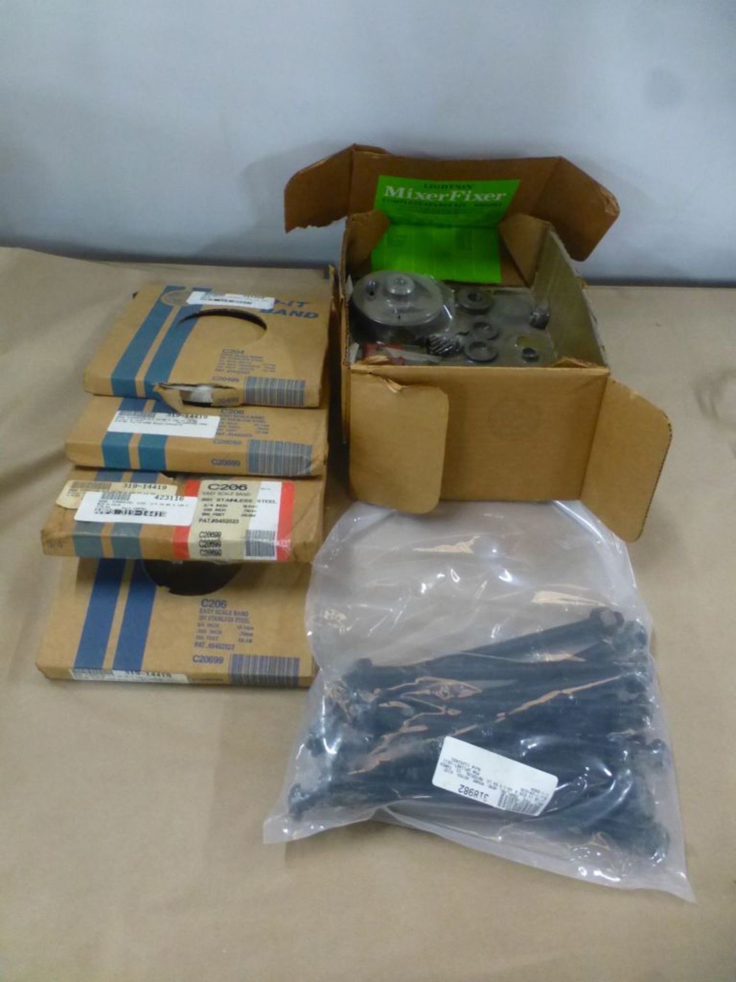 Lot of Assorted Components|Includes:; Strapping Band; Coupling; Bolt; Spare Kits|Lot Loading Fee: $5 - Image 2 of 11