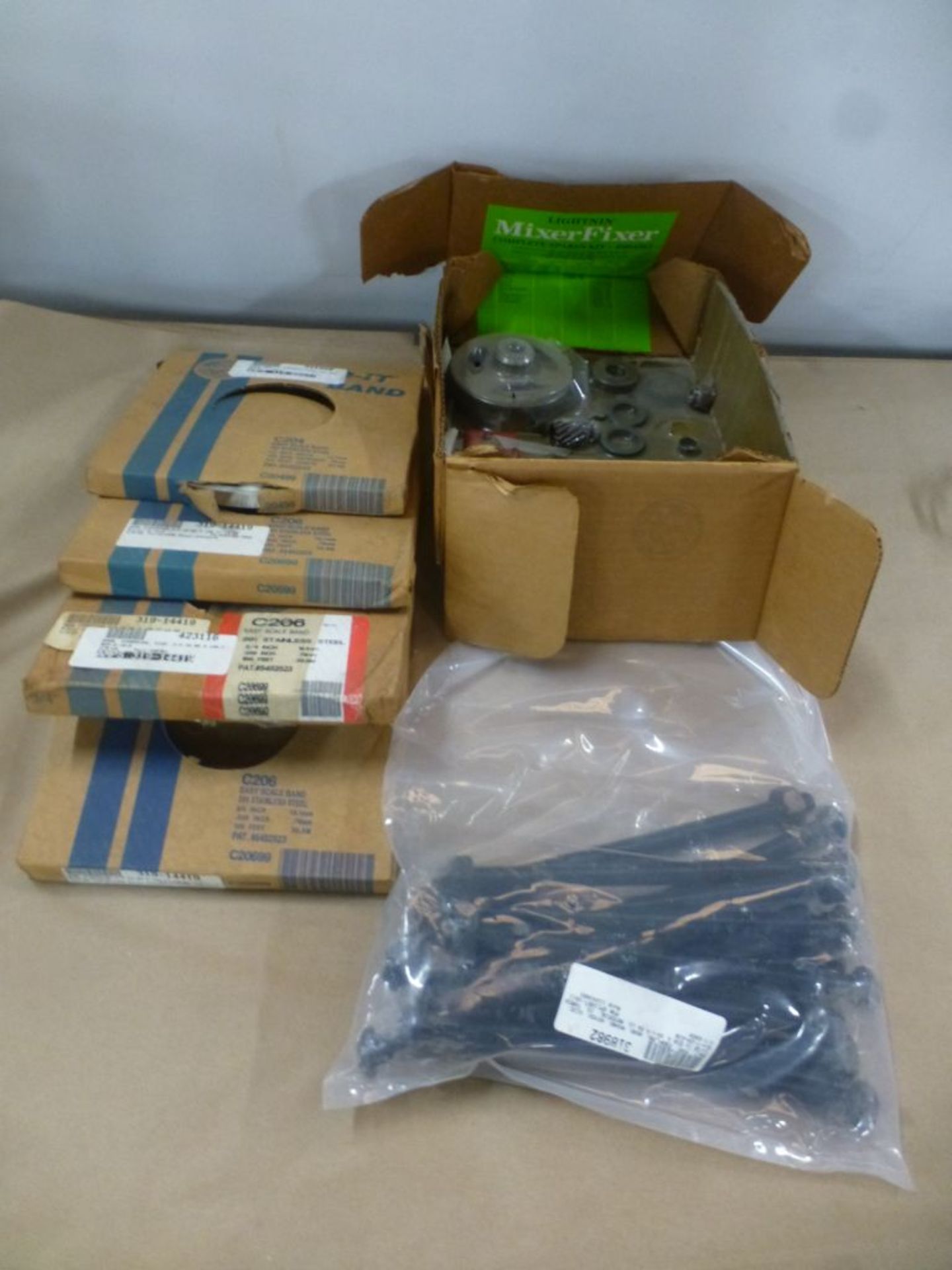 Lot of Assorted Components|Includes:; Strapping Band; Coupling; Bolt; Spare Kits|Lot Loading Fee: $5