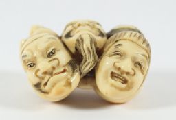 NETSUKE MASKENGRUPPE, Elfenbein, fein geschnitzt, graviert und teils farbig akzentuiert. Gruppe