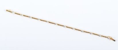 ARMBAND, 585/ooo Gelbgold, besetzt mit zwölf Brillanten, zusammen ca. 0,40 ct., L 18, 10,6g