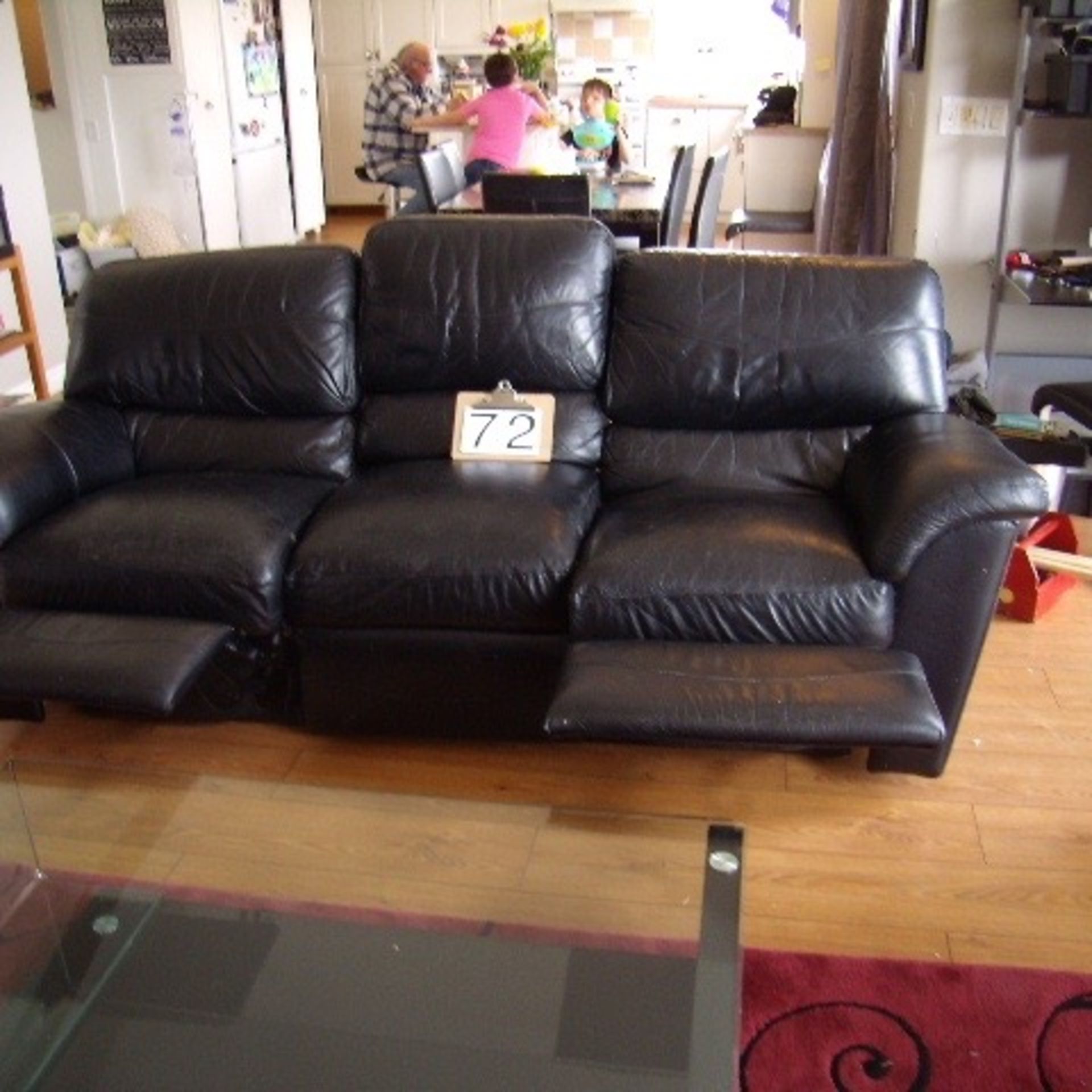 Black leather recliner sofa