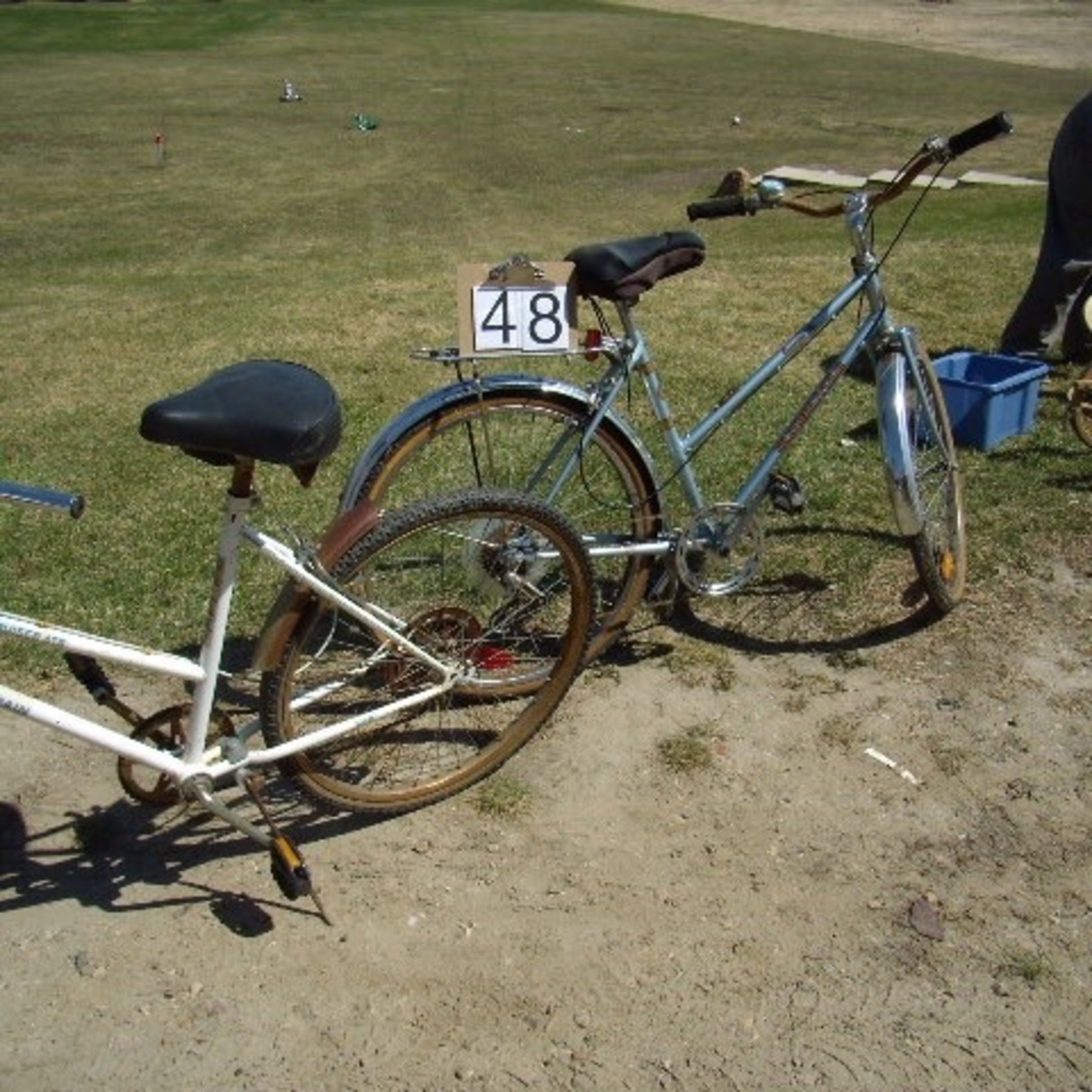 2 ladies bikes 1 blue & white, 1 Silver