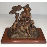 Early 20thC Bronze statue of Peasant boy at rest with his faithful dog , housed on wooden stand,