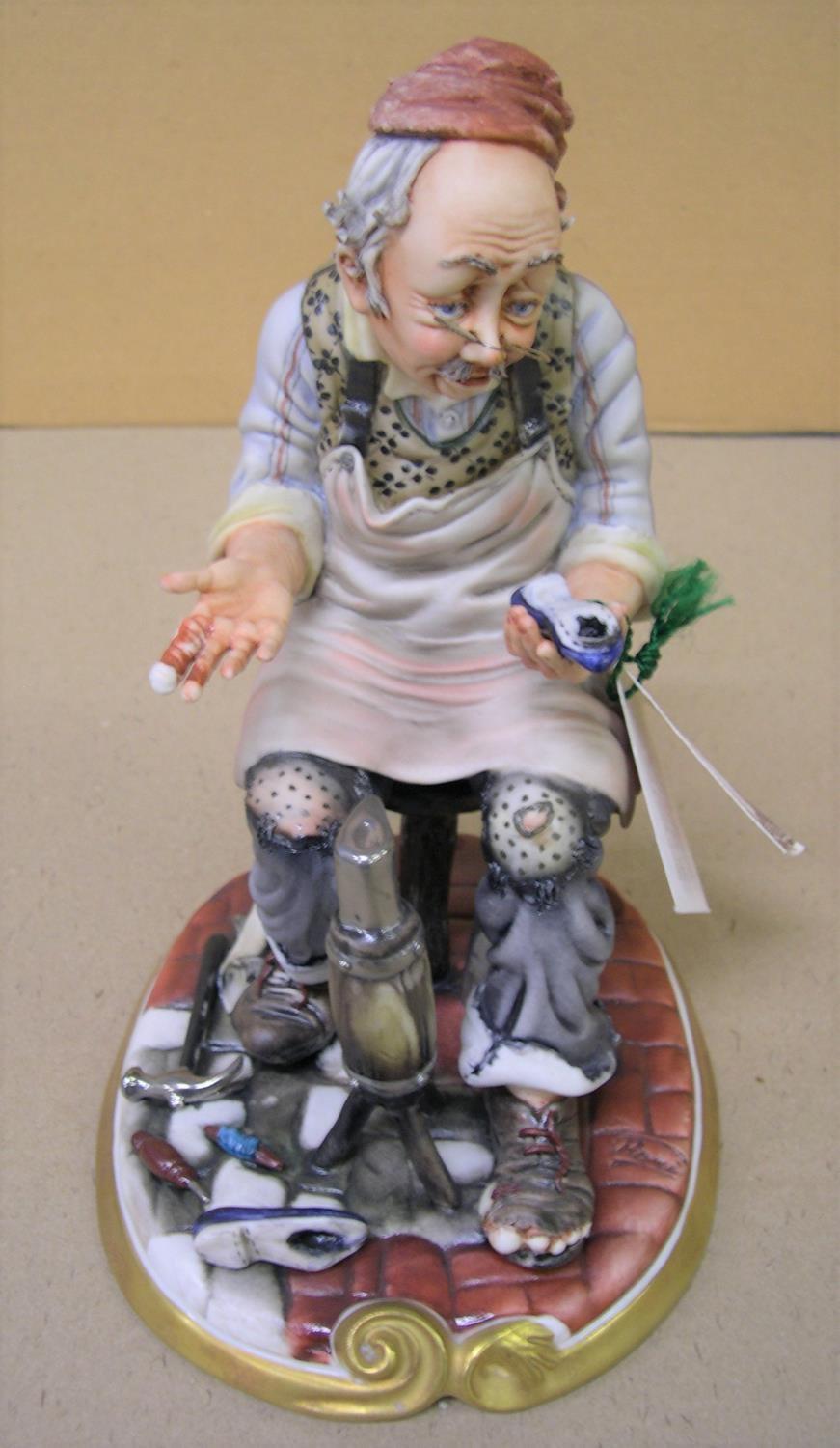 Capodimonte "The cobbler" complete with original label and in superb, compete condition, 24 cm high