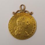 George III 1768 half-guinea (VF) with 9ct pendant hanger, 4 .4 grams total weight