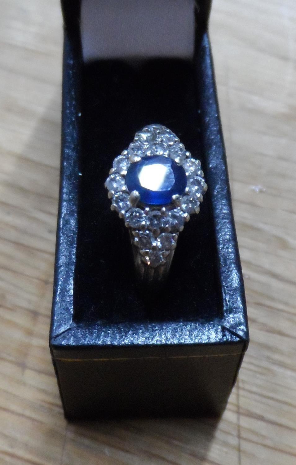 Fine quality, oval cut Sapphire surrounded by 18 round cut, high quality diamonds set in white - Image 2 of 7