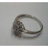 9ct white gold, diamond cluster (approx 0.1ct) ring Approx 1.6 grams gross, size M/N