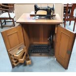 Gritzner Treadle Sewing Machine, c1920 in original walnut cabinet, Dimensions are 77 x 69 x 47 cm