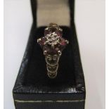 9ct yellow gold cluster ring with rubies below a central diamond Approx 1.5 grams gross