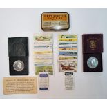 Interesting collection of cigarette cards, small metal tin and 2 cased festival of Britain crowns (