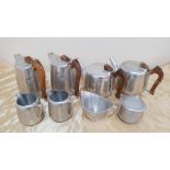 2 sets of vintage Picquot Ware tea sets, comprising of 2 tea pots, 2 hot-water pots, milk jug &