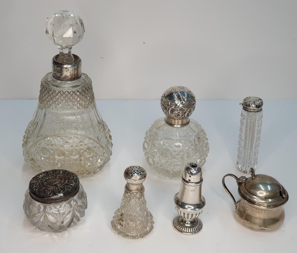 Various items of English silver to include silver toped scent bottles, jars, etc (7) some slightly