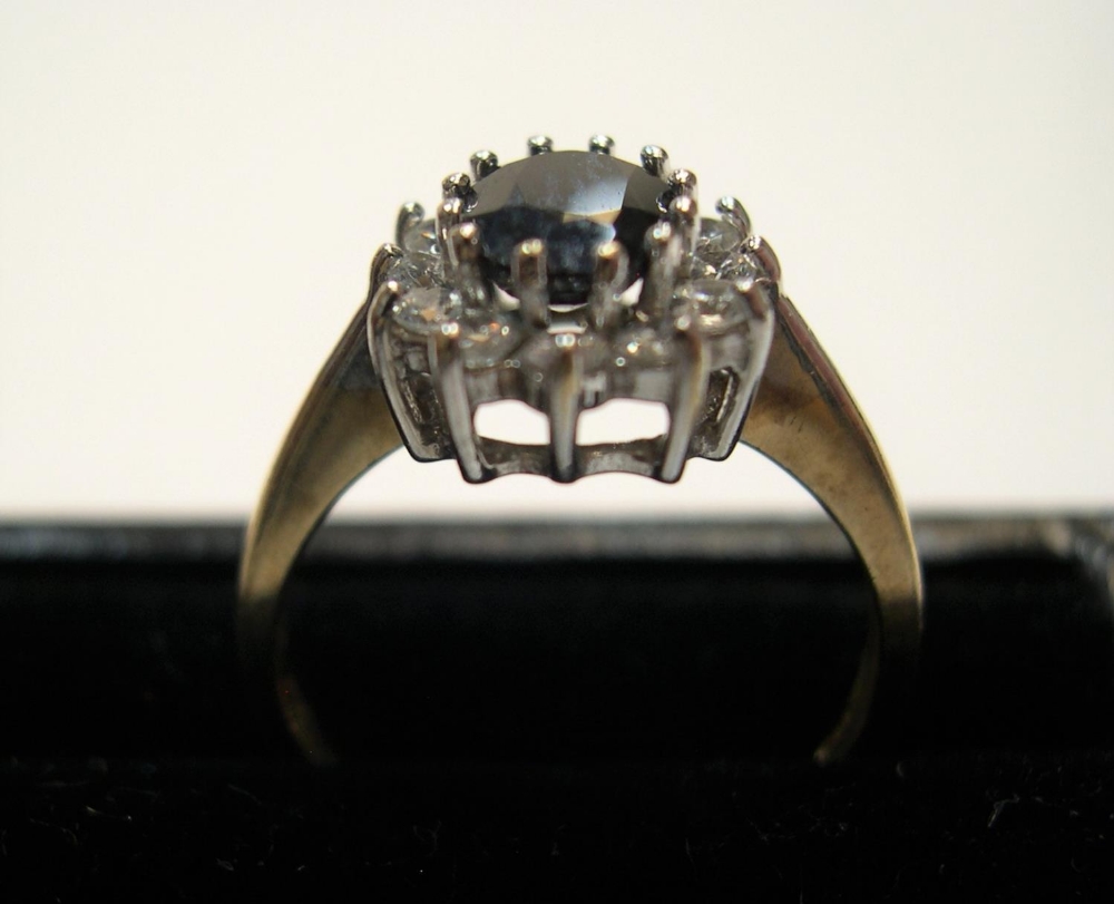 9ct yellow gold dress ring with large central sapphire surrounded by CZ Approx 2.4 grams gross - Image 2 of 3