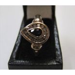 9ct yellow gold ring with pear cut sapphire surrounded by white stones. Approx 1.5 grams gross, size