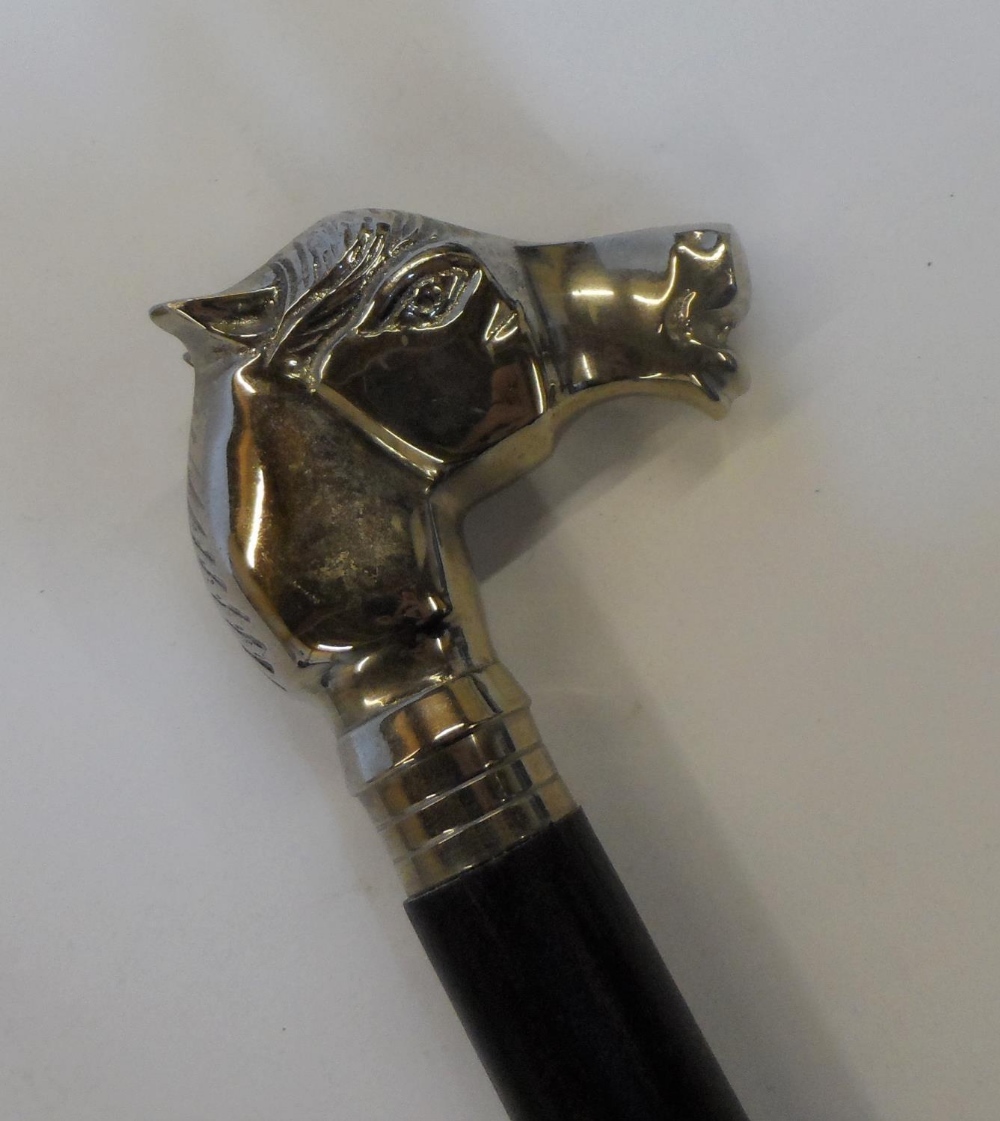 Unmarked, white metal horses head & ebonised wood walking stick with a white metal unmarked tip. The - Image 2 of 4