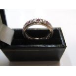 9ct yellow gold eternity ring with diamond & pink sapphire Approx 2.8 grams gross, size P