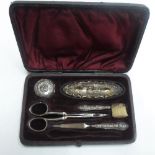Antique cased grooming kit with silver backed brushes and silver handled items (1item missing)