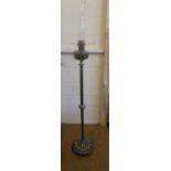 A heavy brass Victorian column oil lamp on tri-pod feet, 173 cm tall