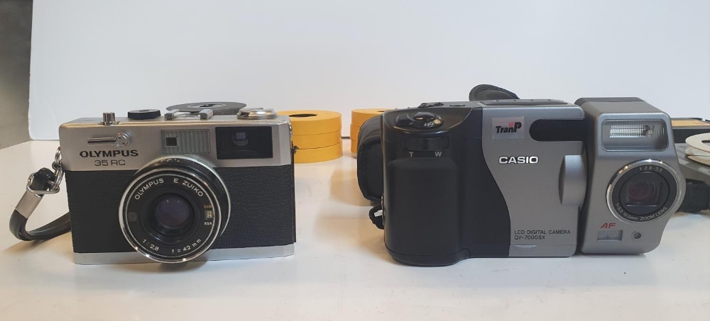An Olympus 35 RC camera & a Casio digital camera, both with cases together with tape reels etc (lot) - Image 2 of 2