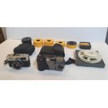 An Olympus 35 RC camera & a Casio digital camera, both with cases together with tape reels etc (lot)