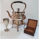 An EPNS Tea-pot on a stand together with a white metal goblet and an old wooden cigarette box (4)