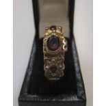 9ct yellow gold, 3 stone garnet ring Approx 2.8 grams gross, size N/O