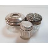 Three early 20thC glass jars with silver lids (3), The jars measure 28 grams