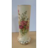 A Royal Worcester cylindrical vase, decorated with a spray of wild flower, raised on a gilt