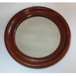 Fine quality small antique circular hanging mirror in a burr walnut frame, 27 cm in diameter