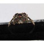 9ct yellow gold, 5 garnet ring Approx 1.5 grams gross, size N/O