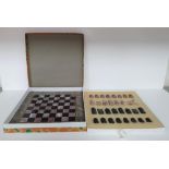 Fine quality, complete (32 pieces) onyx carved chess set and onyx board in its original box