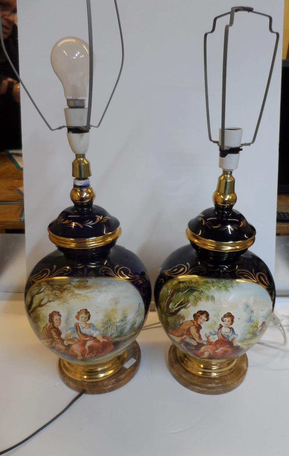 Hand painted pair of later 20thC ceramic table lamps, painted with 18thC figures & on circular