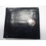 Leather wallet with unmarked silver coloured disc bearing the Prince of Wales feathers & was