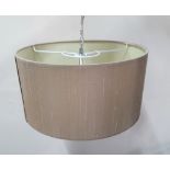 Contemporary light fitting with a 3 bulb fitting within an enclosed beige hanging shade, 40 cm in