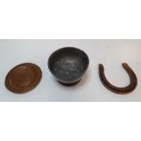 Three metal items to include a beaten pewter bowl, solid copper horseshoe & a small copper plate,