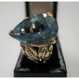 9ct yellow gold ring with large pear cut blue topaz, stone measures approx 15mm x 10mm Approx 5.6