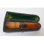 Amber cheroot holder with silver banding and in its original case, 7 cm long In fine condition