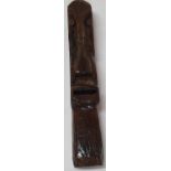 Hand-carved face, similar to the Easter Island stone figures on the back of an old plane, Approx