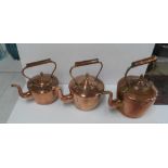 Three antique copper kettles (3)