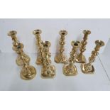 Four pairs of antique brass candlesticks (4)