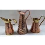 Three fine quality antique copper jugs, 2 with brass edgings & handles (3)